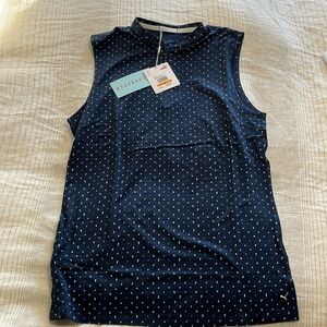 Puma golf sleeveless top. 1/4 zip. Blue and white dot.